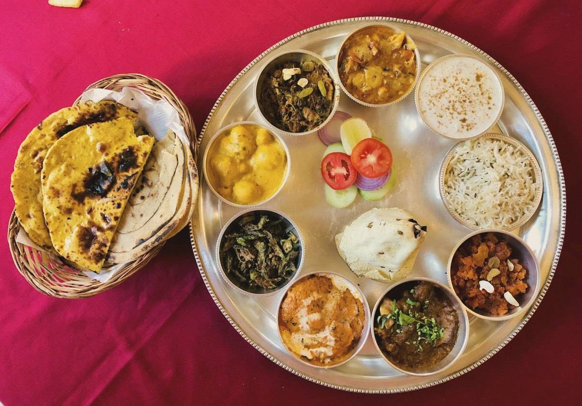 A vegetarian thali with rotis, dal, sabzi and rice