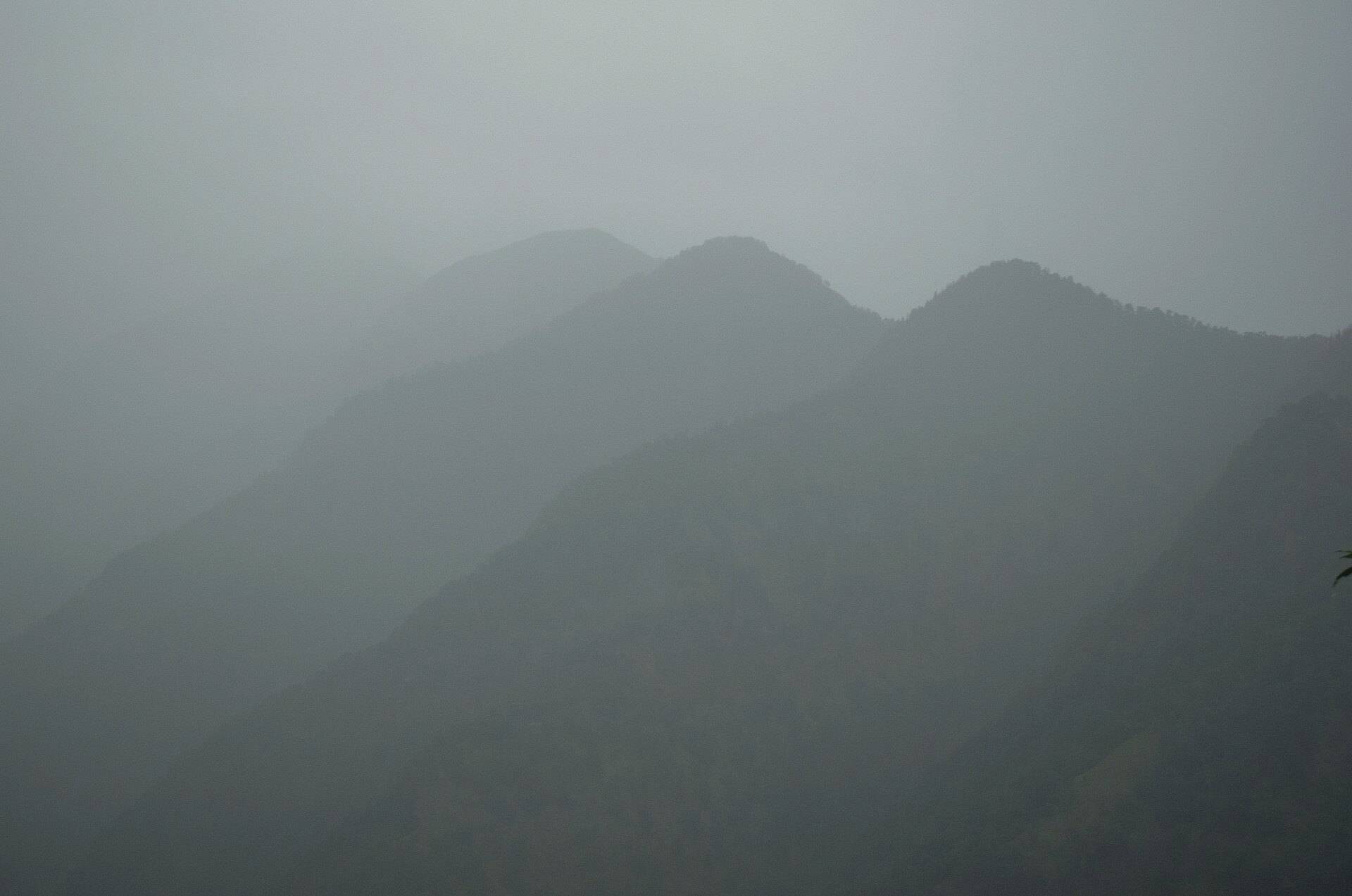 Misty mountain ridges at dawn seen from Triyuginarayan